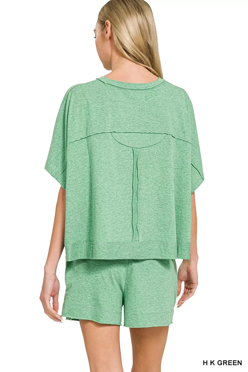 Green Zenana exposed seam boxy top and shorts set by Trendsi, featuring casual style and comfortable fit.