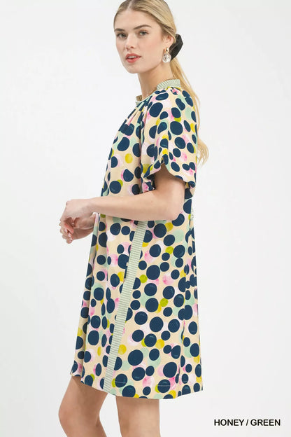 Honey green polka dot print tunic dress by Umgee featuring long sleeves and a relaxed fit, perfect for casual wear.