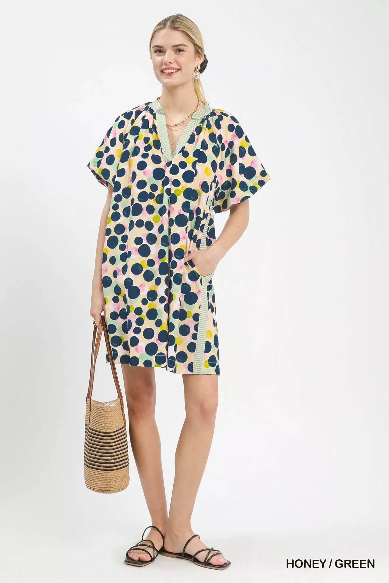 Honey green Umgee polka dot print tunic dress with long sleeves and relaxed fit, featuring a stylish, casual design.