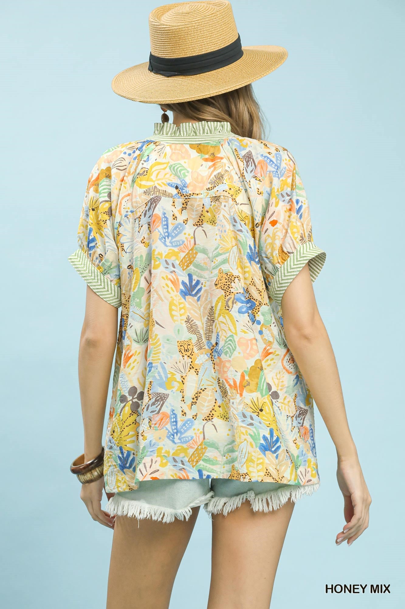 Umgee Mix Boho Printed V-Neck Top in honey color with a relaxed fit and bohemian floral print, short sleeves, and lightweight fabric.