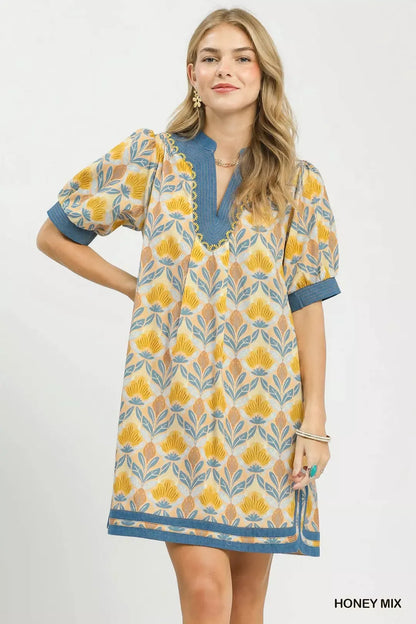 Trendsi Umgee Mix Tile Print Mini Dress featuring a stylish pattern, short sleeves, and a flattering fit in a vibrant tile design.