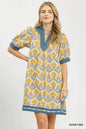 Trendsi Umgee Mix Tile Print Mini Dress featuring a stylish pattern, short sleeves, and a flattering fit in a vibrant tile design.