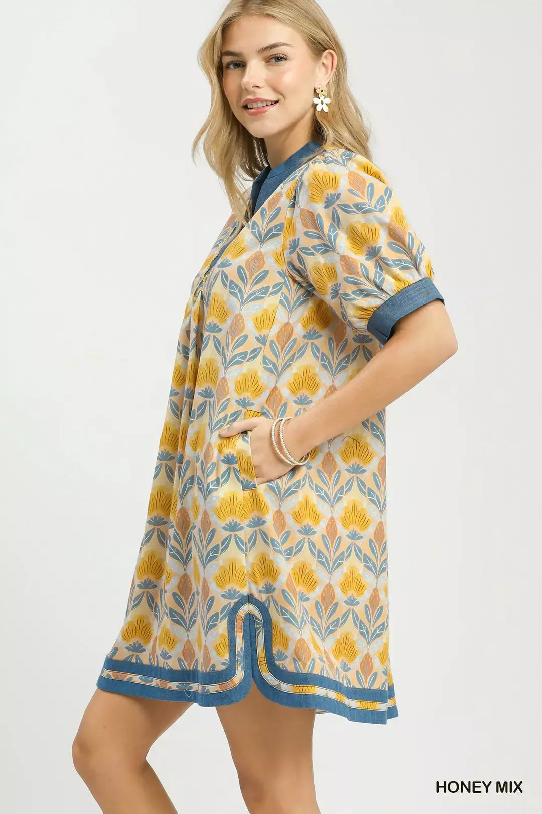 Honey-colored Umgee Mix Tile Print Mini Dress by Trendsi, featuring a stylish pattern and lightweight fabric.