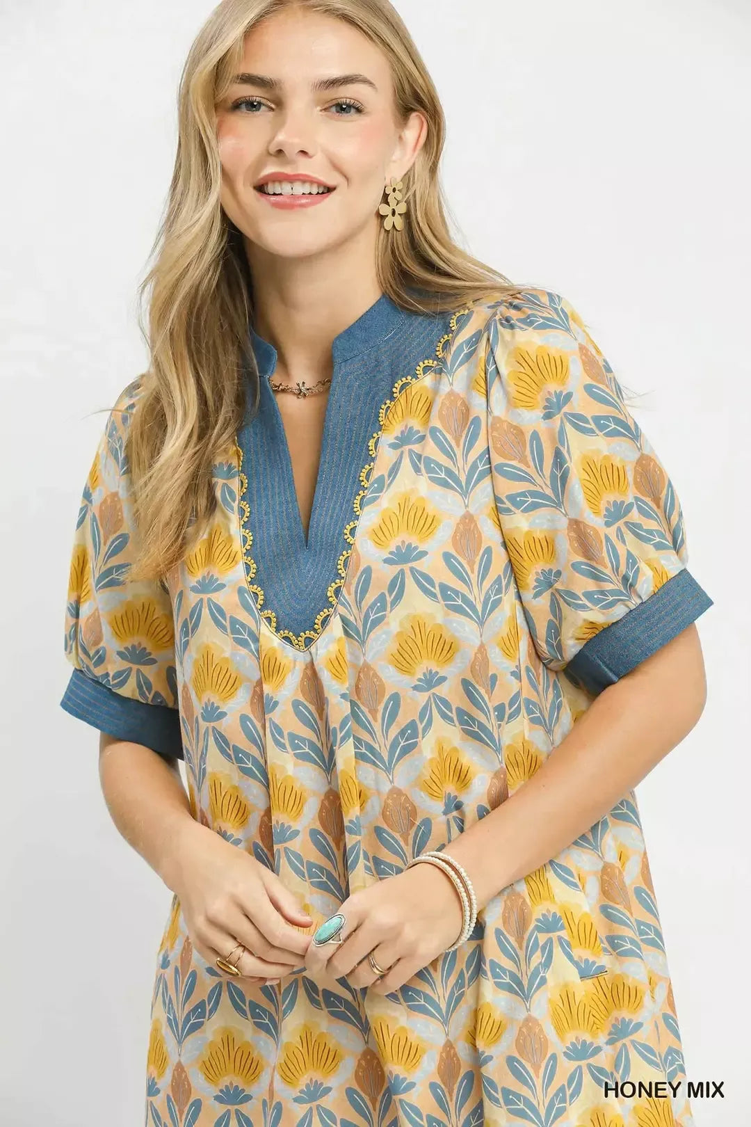 Umgee Mix Tile Print Mini Dress by Trendsi featuring a stylish mini dress with a colorful tile pattern and short sleeves.