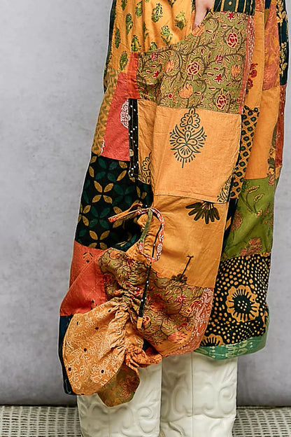 Trendsi POL printed patchwork wide-leg pants with adjustable side drawstring, colorful fabric, and relaxed fit.