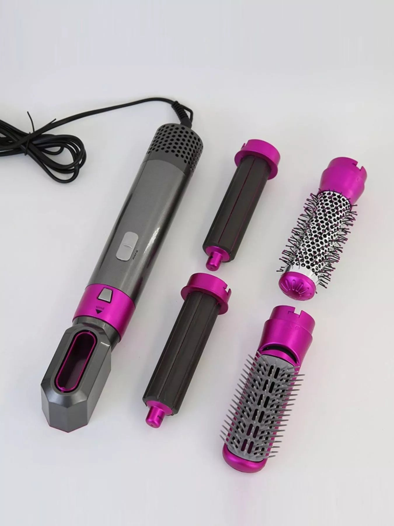 Trendsi hot pink adjustable temperature curling iron with European plug and ergonomic handle for versatile styling.