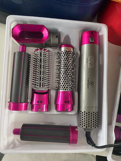 Hot pink Trendsi interchangeable curling iron wand set with European plug, featuring multiple barrel sizes for versatile curls.