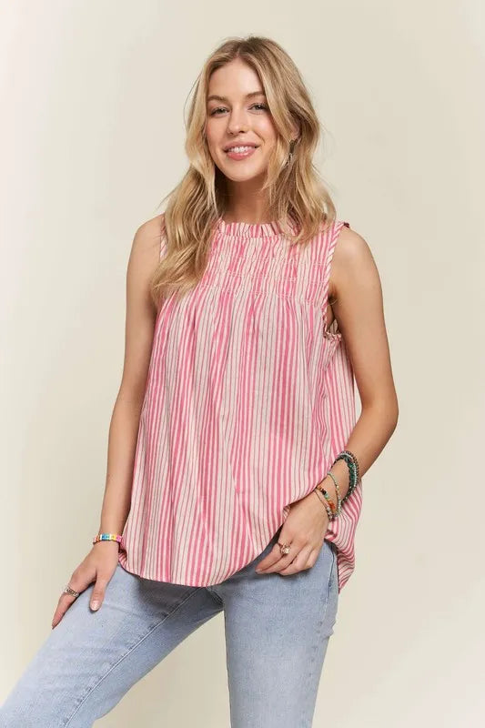 Hot pink ADORA sleeveless top with contrast stripes, frill details, and round neck from Trendsi.