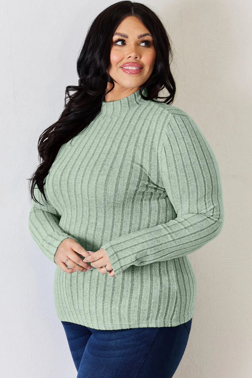 Hot pink Basic Bae full-size ribbed mock neck long sleeve T-shirt by Trendsi, showcasing its fitted ribbed fabric and stylish mock neckline.