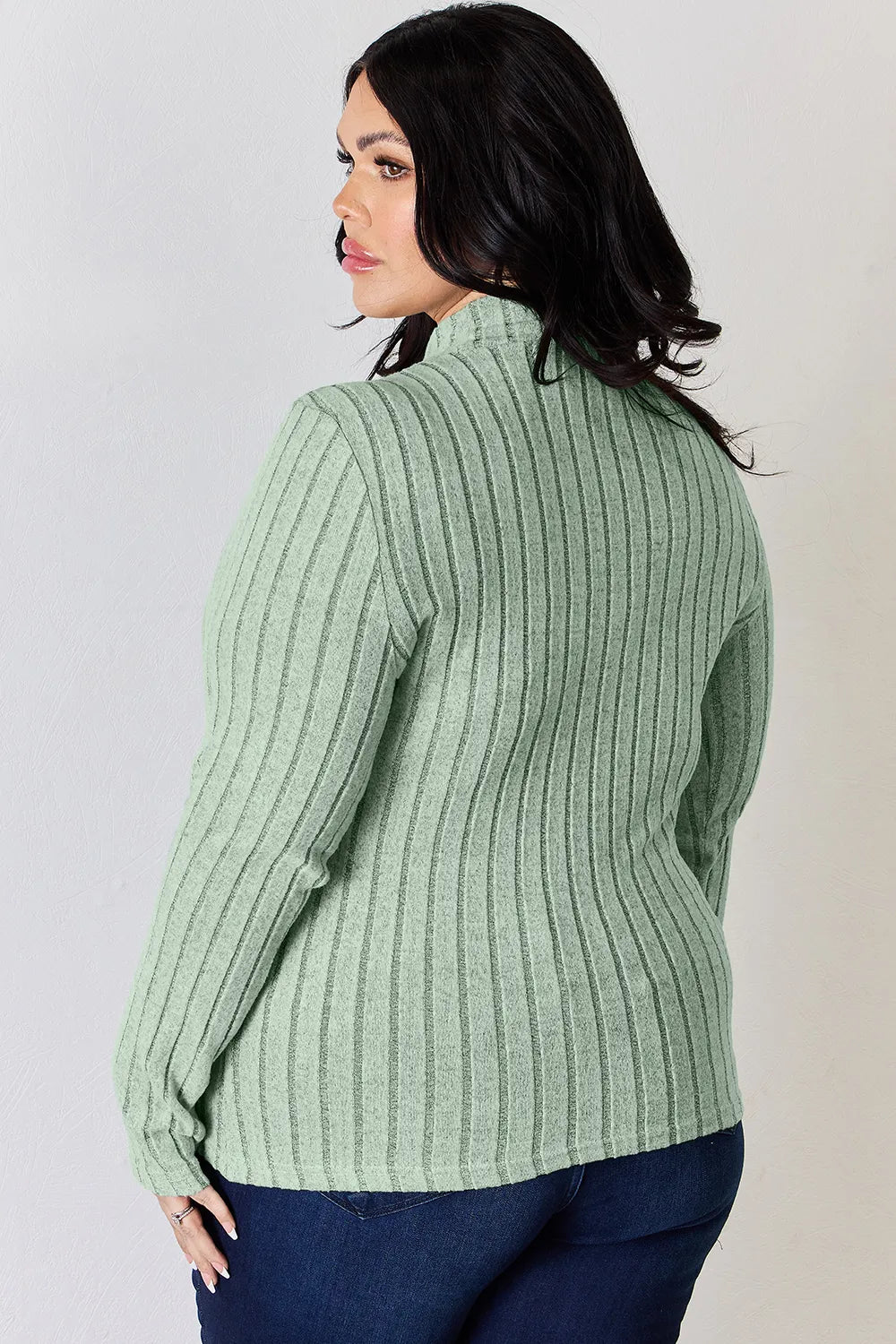 Hot pink Trendsi Basic Bae ribbed mock neck long sleeve T-shirt shown on a model, featuring a fitted full-size design and ribbed texture.