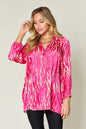 Hot pink Trendsi Double Take full-size printed button-up long sleeve shirt, featuring vibrant pattern and classic collar design.