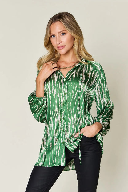 Hot pink Trendsi Double Take full-size printed button-up long sleeve shirt, featuring a vibrant pattern and classic collar.