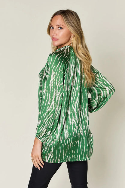 Hot pink double take long sleeve button-up shirt by Trendsi featuring bold printed design and full size fit.