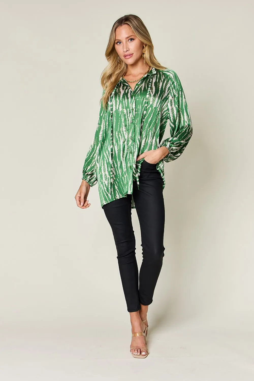 Hot pink Trendsi Double Take full-size printed long sleeve button-up shirt with bold graphic design.