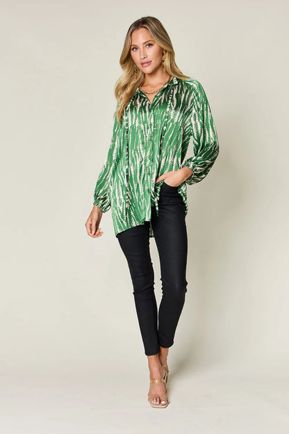 Hot pink Trendsi Double Take full-size printed long sleeve button-up shirt with bold graphic design.