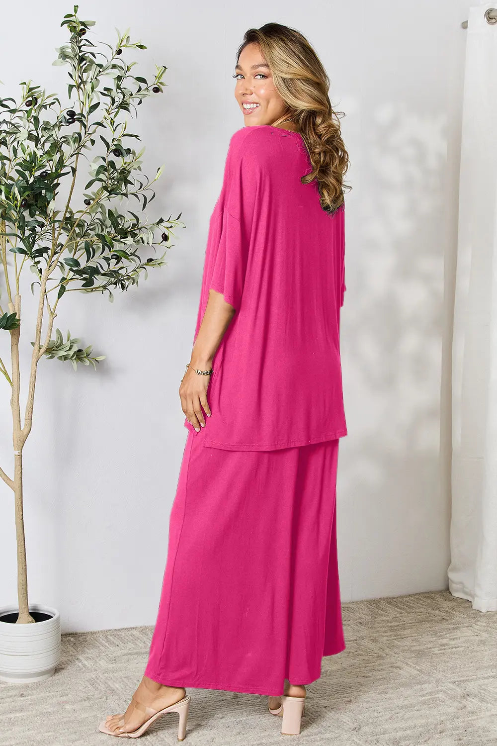 Hot pink double take full-size round neck slit top and matching pants set by Trendsi, styled for a modern, casual look.