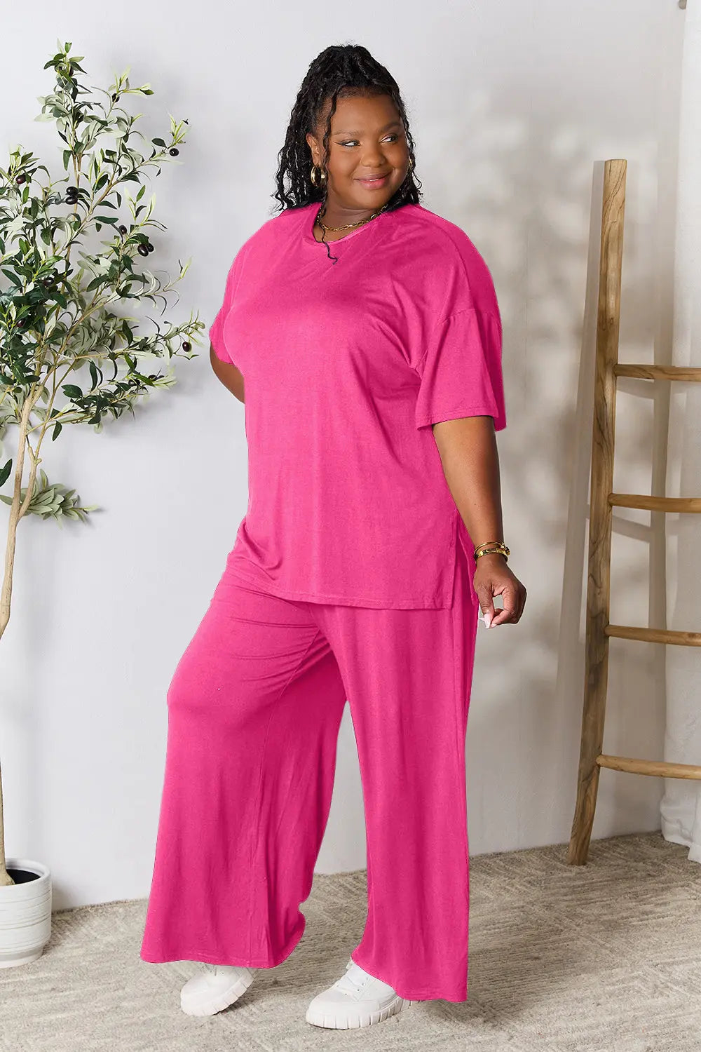 Hot pink Trendsi Double Take full size round neck slit top and matching pants set, casual and stylish for everyday wear.