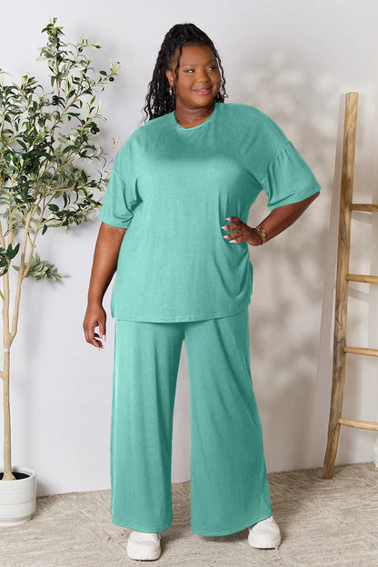 Trendsi hot pink double take full-size round neck slit top and matching pants set, stylish and comfortable women's outfit.