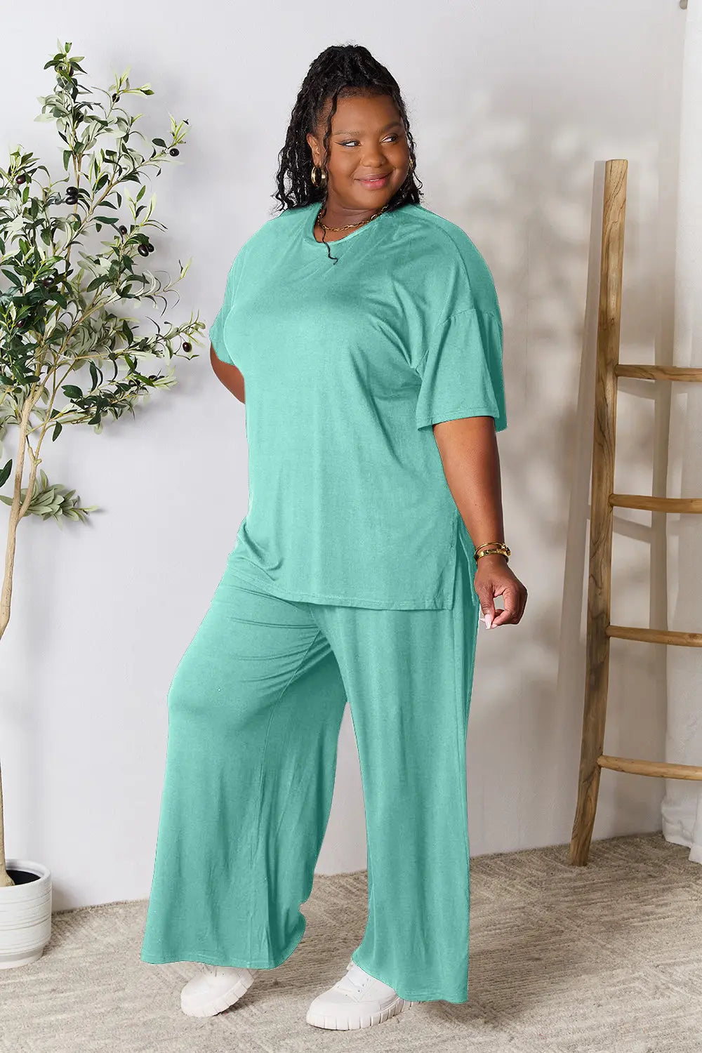 Hot pink double take full-size round neck slit top and pants set by Trendsi, featuring a stylish, coordinated outfit.