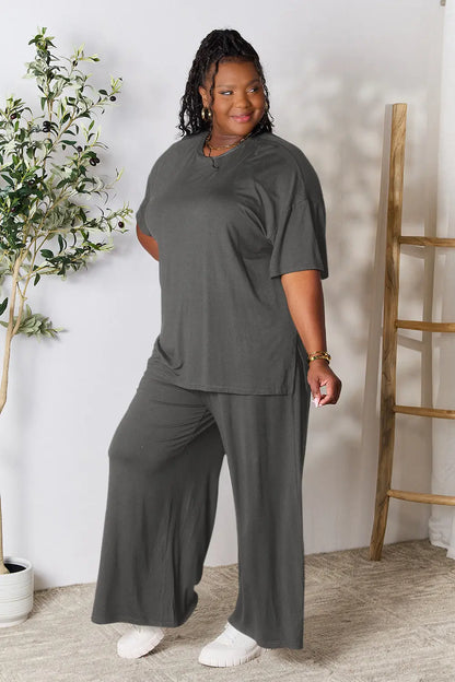 Hot pink double take full size round neck slit top and matching pants set by Trendsi, stylish and comfortable ensemble.