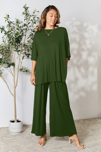Hot pink double take full size round neck slit top and matching pants set by Trendsi, styled for a casual or stylish look.