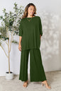 Hot pink double take full size round neck slit top and matching pants set by Trendsi, styled for a casual or stylish look.
