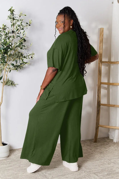 Hot pink double take full-size round neck slit top and matching pants set by Trendsi, styled for a casual or chic look.