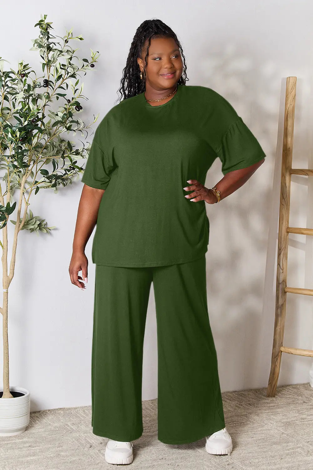 Hot pink double take full-size round neck slit top and matching pants set by Trendsi, shown on a model.