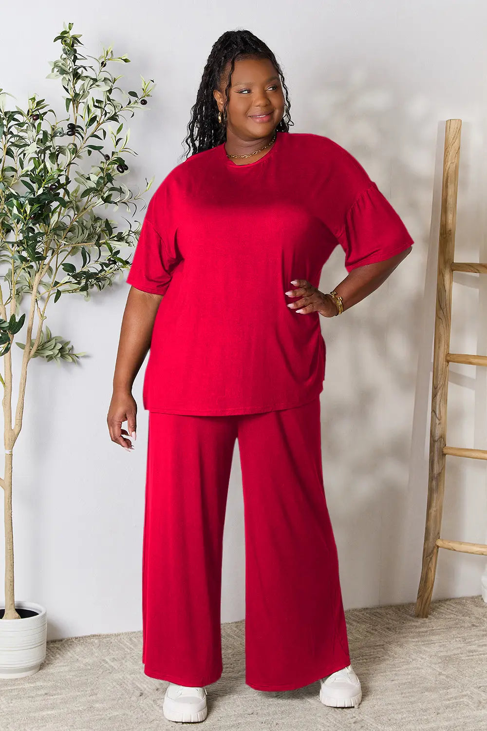 Hot pink double take full-size round neck slit top and matching pants set by Trendsi, shown on a model.