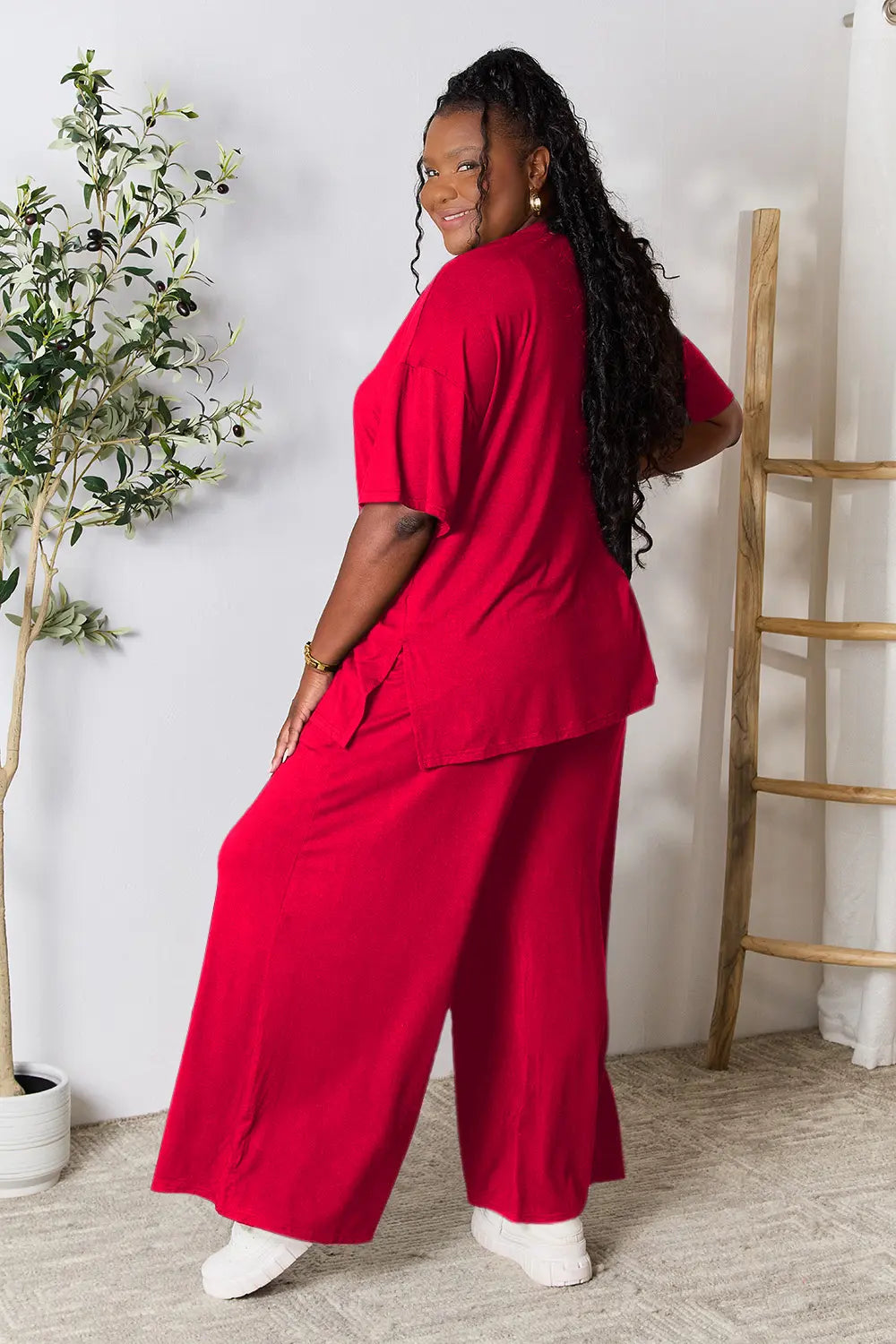 Hot pink double take full-size round neck slit top and pants set by Trendsi, stylish and comfortable for casual wear.