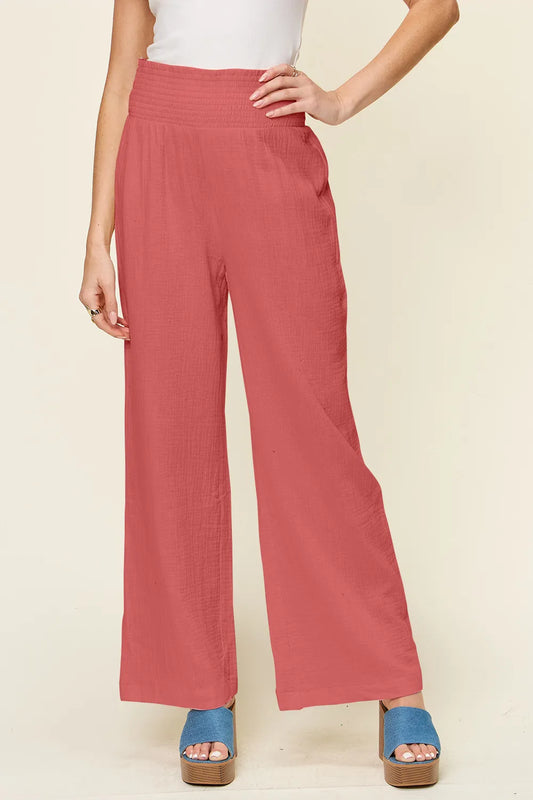 Hot pink Trendsi Double Take full-size texture smocked waist wide-leg pants, showcasing a flowy, stylish design.