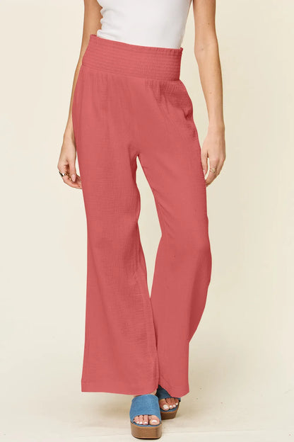Hot pink Trendsi Double Take full-size textured wide-leg pants with smocked waist and relaxed fit.