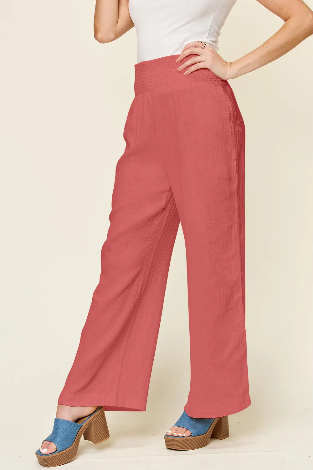 Hot pink Trendsi Double Take full-size wide-leg pants with textured fabric and smocked waist, stylish and comfortable.