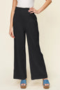 Hot pink Trendsi Double Take full-size textured smocked waist wide-leg pants, showing their flowy design and wide-leg silhouette.