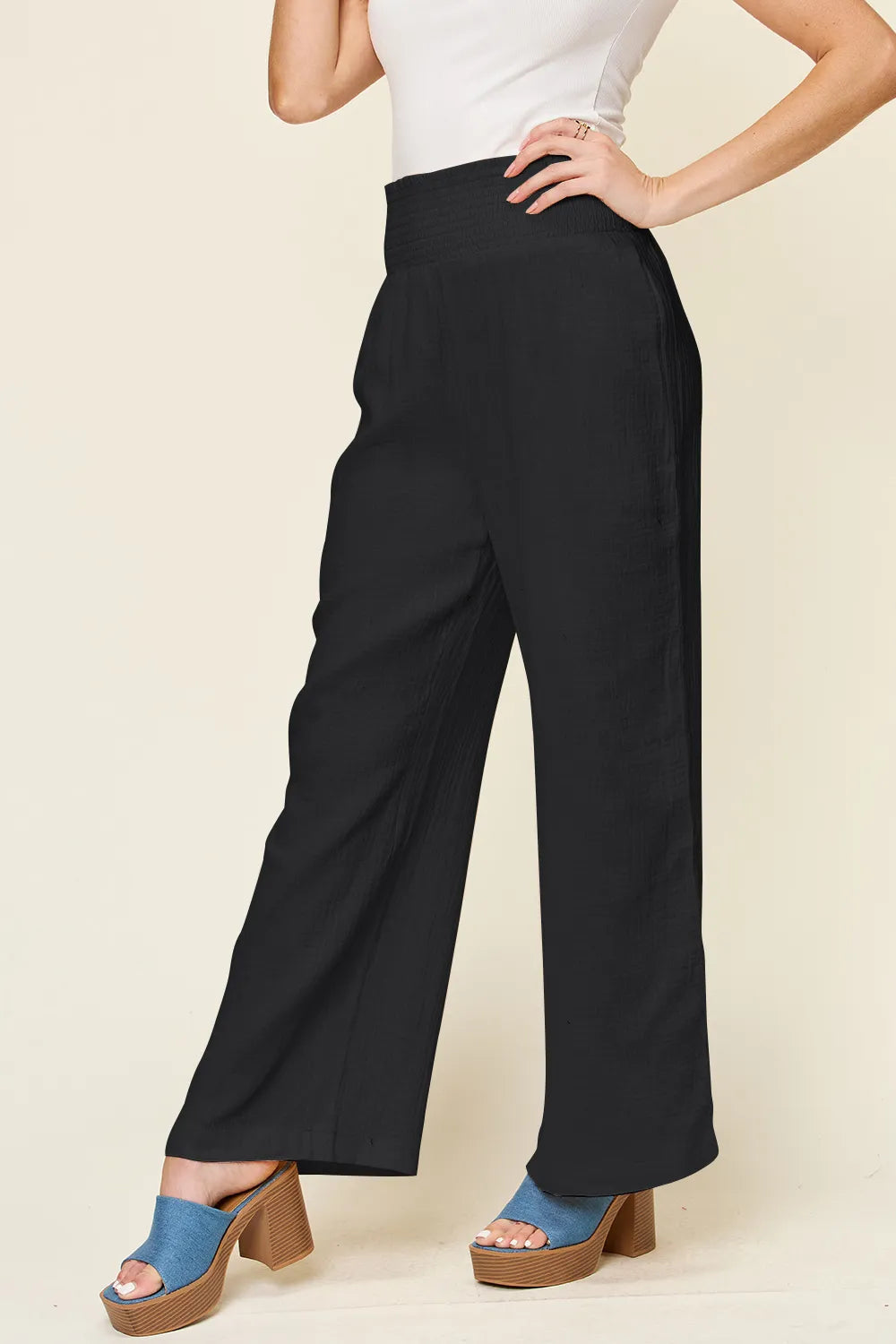 Hot pink Trendsi Double Take full size wide-leg pants with textured fabric and smocked waist, stylish and comfortable.