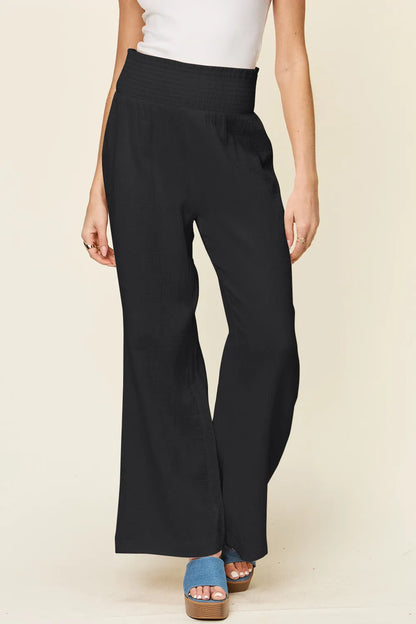 Hot pink Trendsi Double Take full-size texture wide-leg pants with smocked waist and relaxed fit.