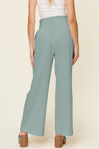 Hot pink Trendsi Double Take full-size wide-leg pants with textured fabric and smocked waist, stylish and comfortable.