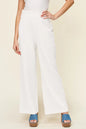 Hot pink double take full-size texture smocked waist wide-leg pants from Trendsi, with a flowy, relaxed fit and stylish design.