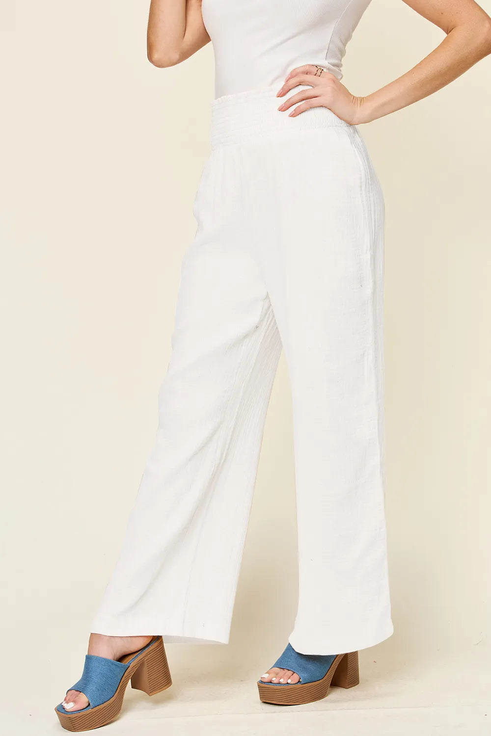 Hot pink Trendsi Double Take full-size wide leg pants with textured fabric and smocked waist, stylish and comfortable.
