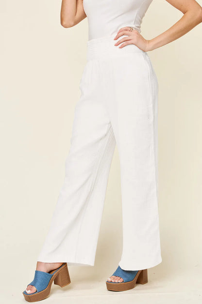 Hot pink Trendsi Double Take full-size wide leg pants with textured fabric and smocked waist, stylish and comfortable.
