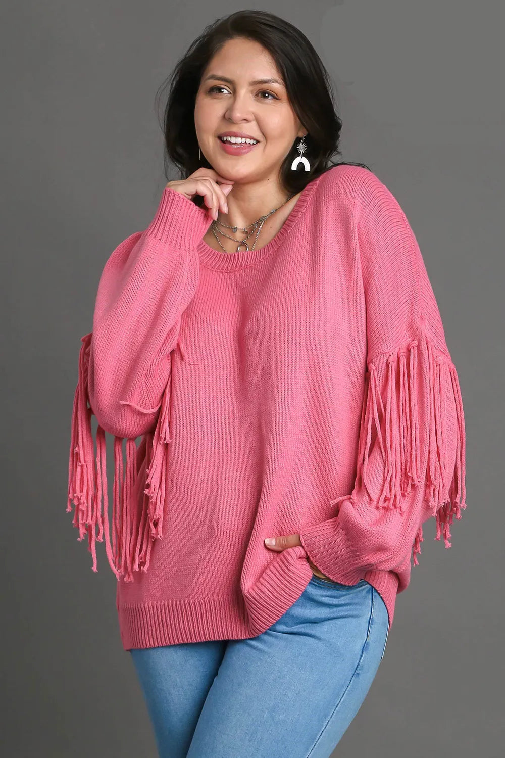 Hot pink plus size Umgee sweater with fringe, round neck, and long sleeves, featuring a cozy, stylish design.