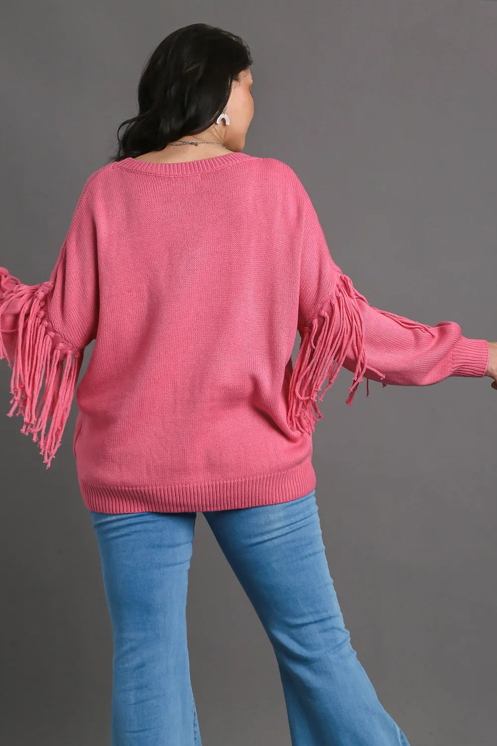 Hot pink Umgee plus size fringe round neck long sleeve sweater from Trendsi, cozy and stylish with fringe details