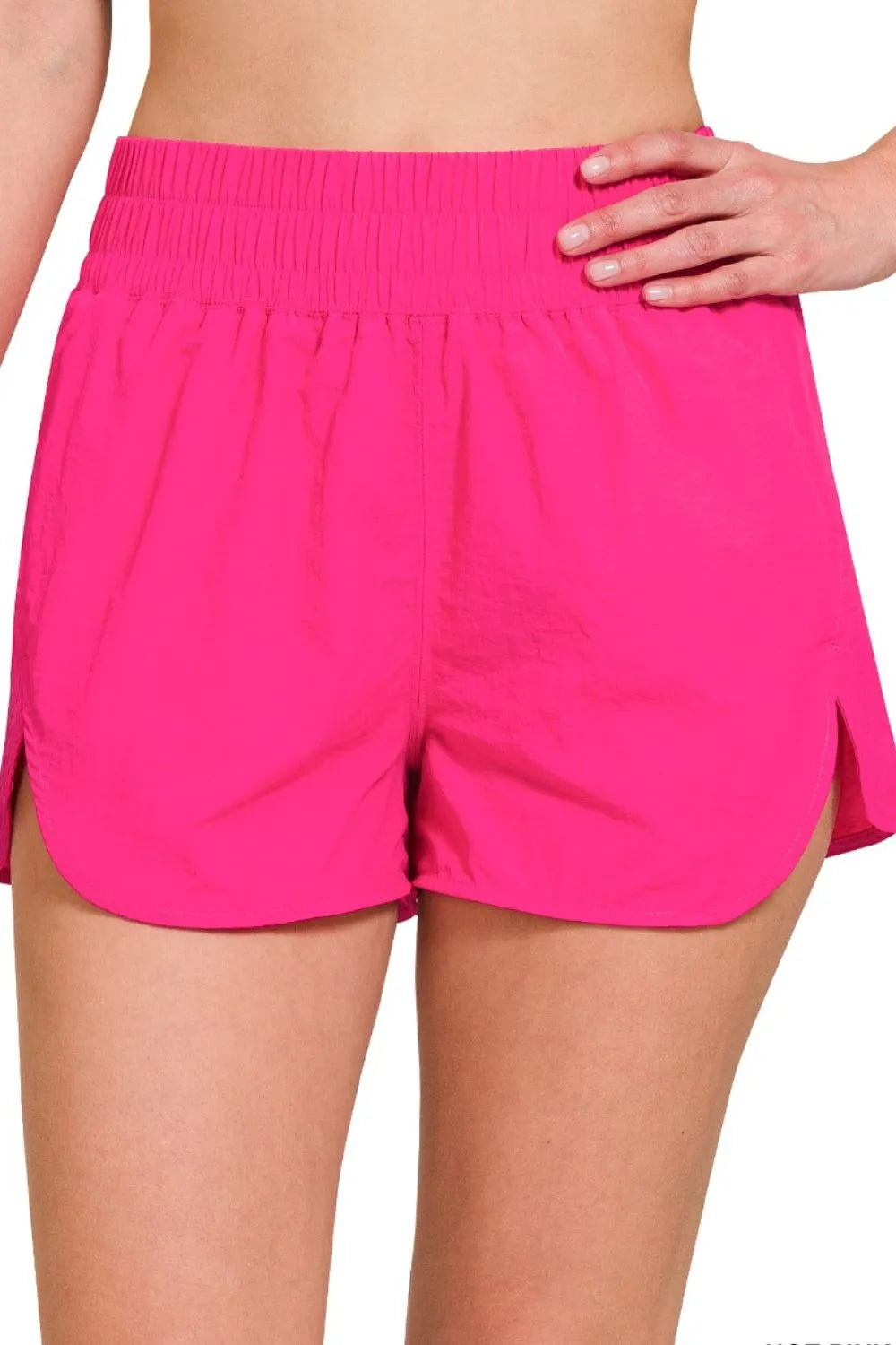 Hot pink Zenana windbreaker running shorts with smocked waistband, perfect for athletic and casual wear.