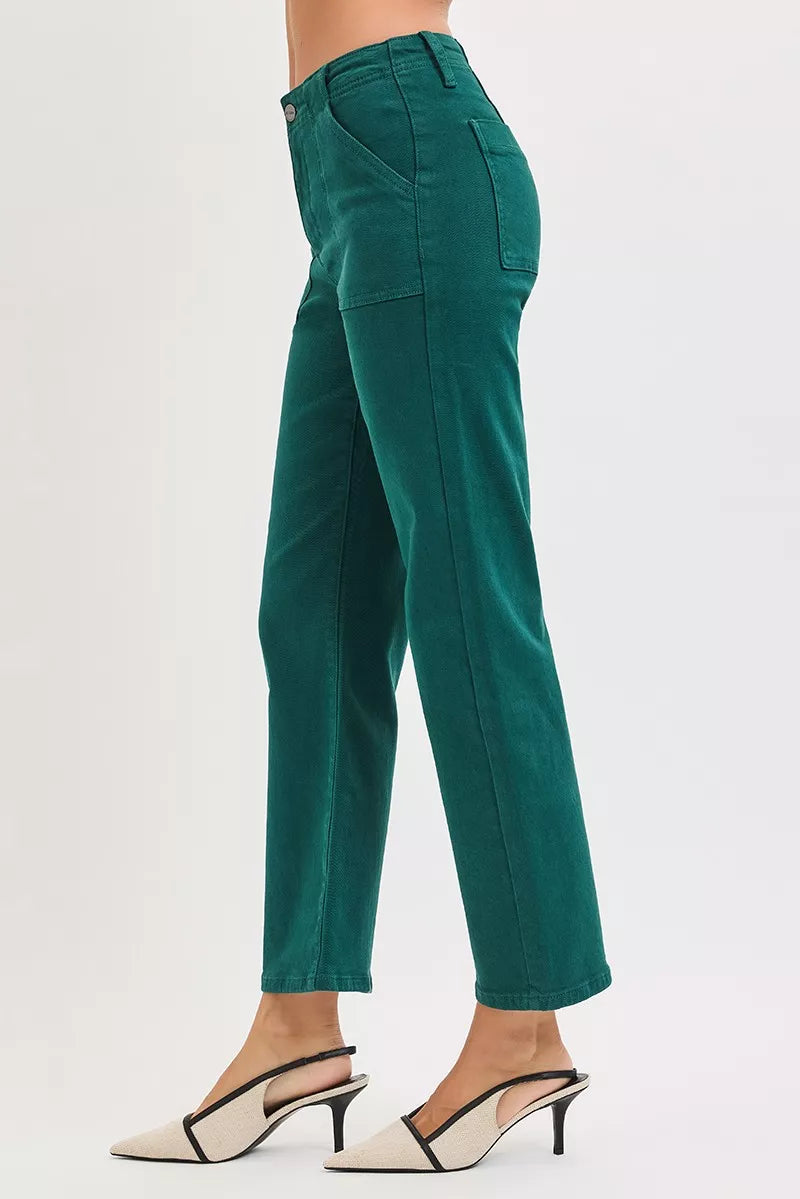 Hunter green RISEN high-rise ankle flare jeans with patch pockets and a fitted waist, styled with rolled cuffs.