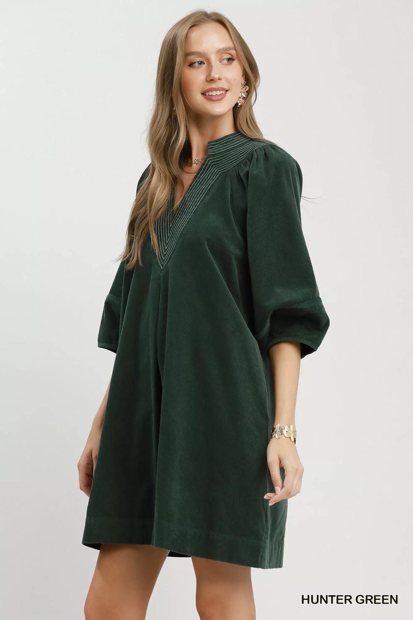 Hunter green Umgee corduroy V-neck puff sleeve shift dress with pockets, featuring a stylish and comfortable design.