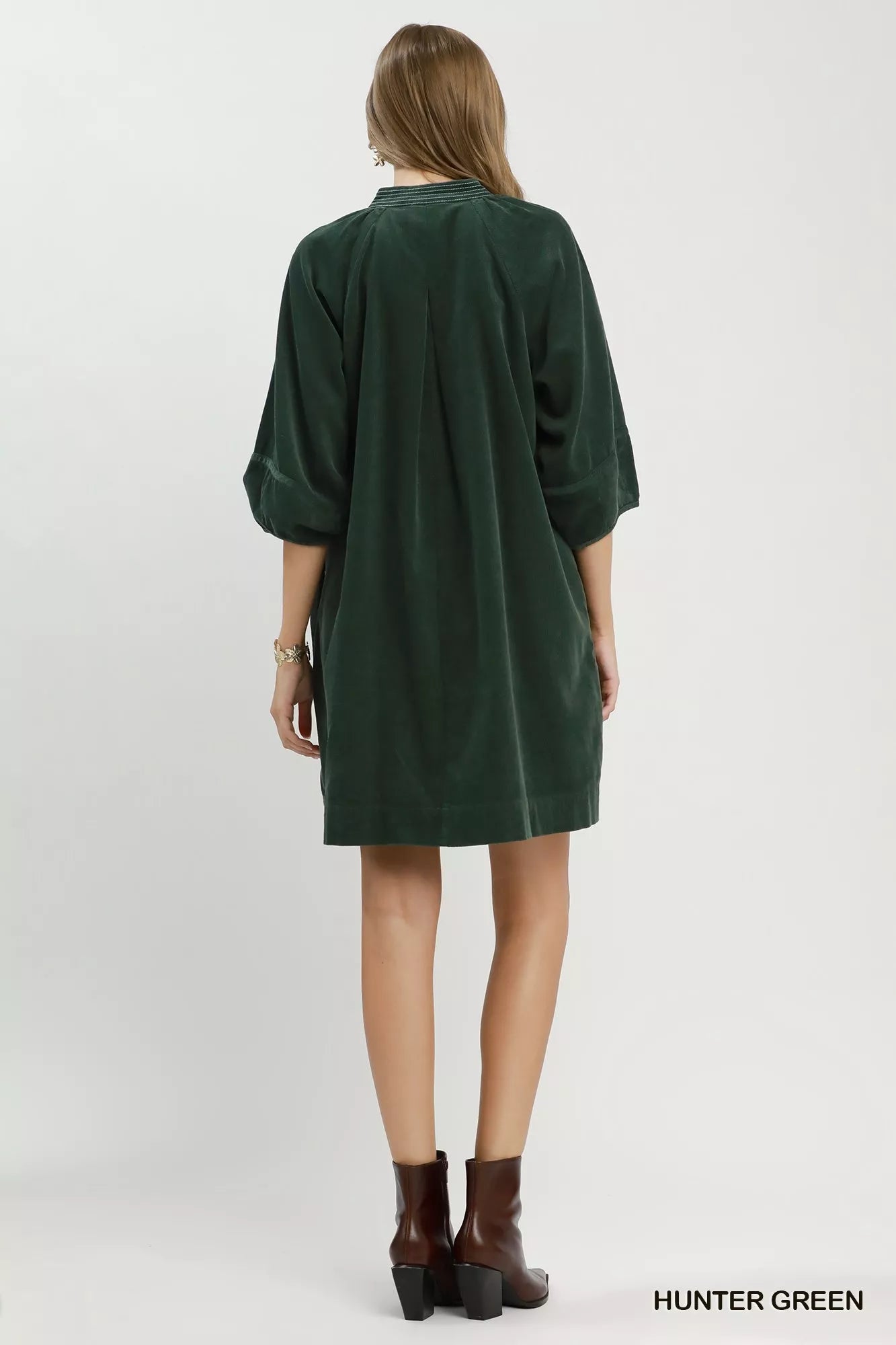 Hunter green Umgee corduroy V-neck puff sleeve shift dress with pockets, featuring a casual, stylish design.