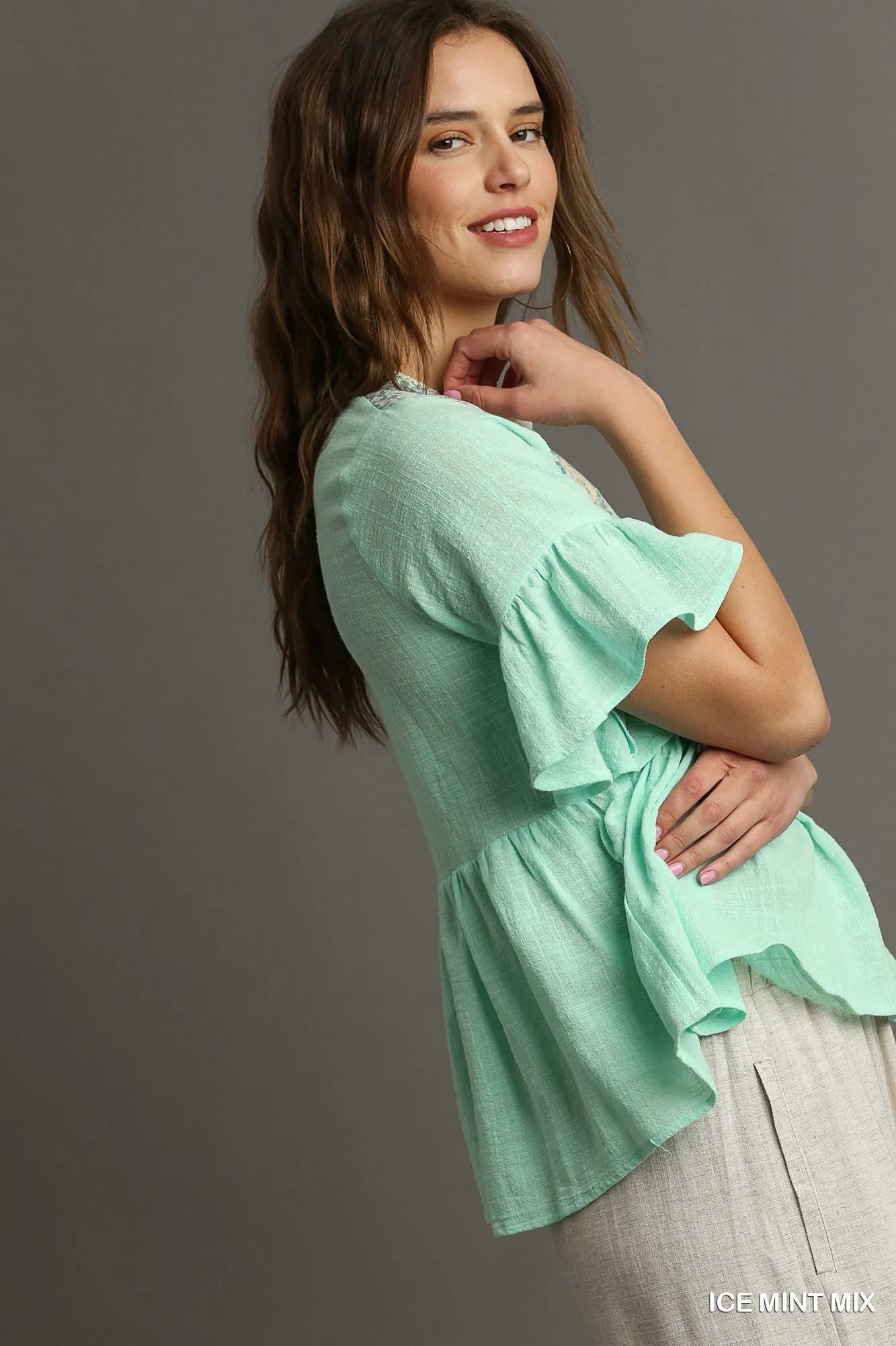 Ice mint Umgee floral lace trimmed half sleeve babydoll top with delicate lace details and a relaxed fit, perfect for casual wear.