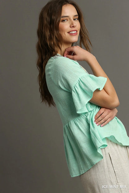 Ice mint Umgee floral lace trimmed half sleeve babydoll top with delicate lace details and a relaxed fit, perfect for casual wear.
