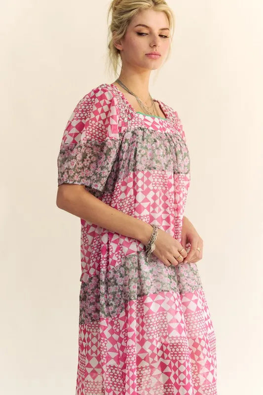 Indian pink Davi & Dani floral square neck puff sleeve maxi dress with a flowing silhouette and vibrant multicolor floral pattern.