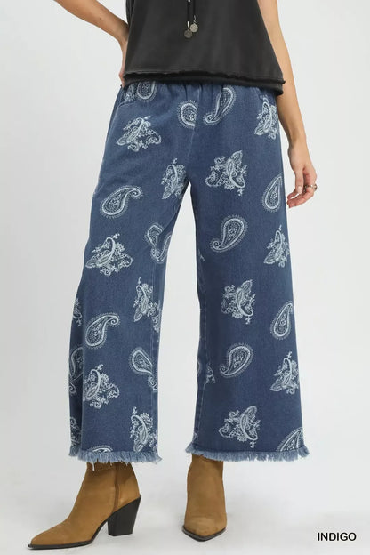Indigo Umgee Denim Paisley Wide-Leg Pants with relaxed fit and wide silhouette, featuring paisley pattern details.